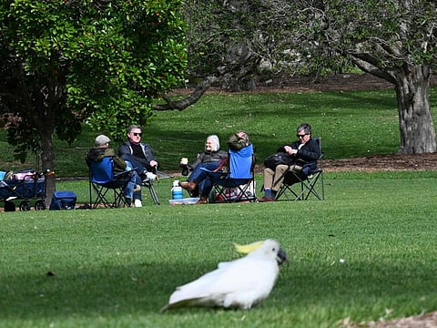 Families and friends enjoy their afternoon at the Botanic garden in Sydney on September 13, 2021 after restrictions were lifted by the New South Wales state.