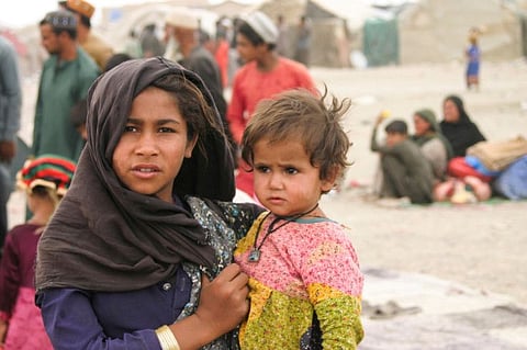 Afghans with their families at their makeshift tents. The UN says “recent developments’’ have increased the vulnerability of Afghans who have already been facing decades of deprivation and violence.