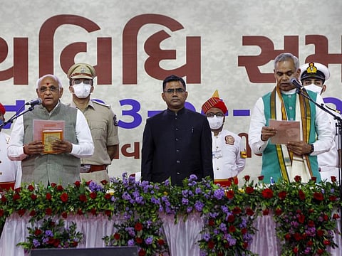 Bhupendra Patel takes oath as new Chief Minister of Gujarat administered by Governor Acharya Devvrat during a swearing-in ceremony at Raj Bhavan in Gandhinagar, on September 13, 2021.
