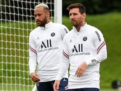 Paris Saint Germain's Lionel Messi (right) in training with teammate Neymar.