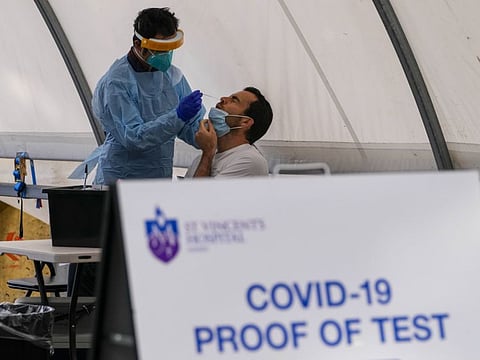 A man receives a COVID-19 test in the eastern suburbs of Sydney on September 14, 2021.