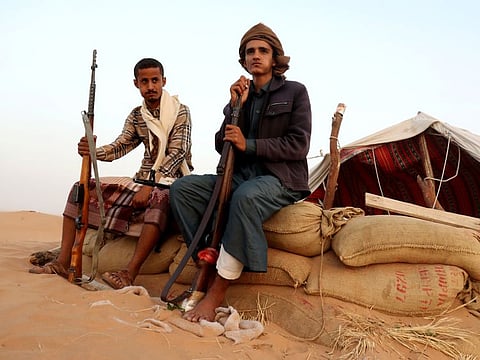 Pro-government forces guard a site near the Safer oil fields in Marib on September 12, 2021.