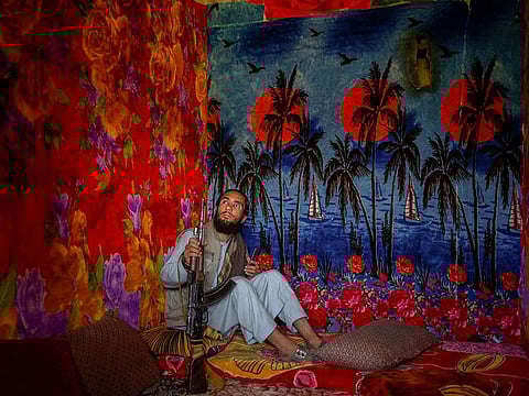 A member of the Taliban sits inside the Pul-e-Charkhi prison in Kabul.