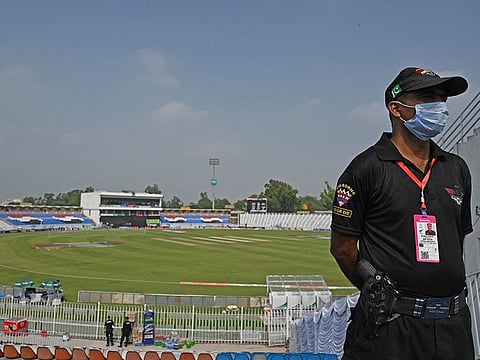 A policeman stands guard on the empty stands of the Rawalpindi Cricket Stadium in Rawalpindi. New Zealand today postponed a series of one day internationals against Pakistan over security concerns, local board officials and New Zealand's cricket body said, minutes after the first match was due to start.
