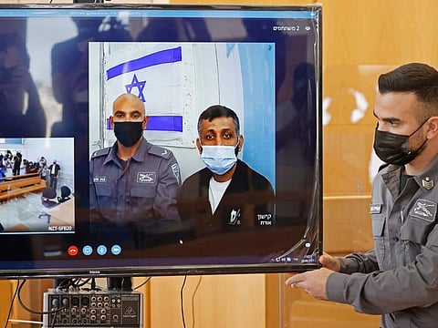 Palestinian fighter Mohammad Ardah (centre) attends via Zoom a court session in the Israeli city of Nazareth on September 19, 2021.