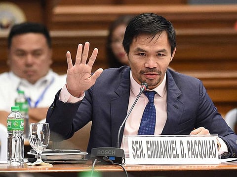This file photo taken on March 6, 2017 shows Philippine boxing icon and senator Manny Pacquiao during a senate hearing in Manila.  Philippine boxer-turned-politician Manny Pacquiao declared on September 19, 2021 he will run for president in 2022, ending months of speculation about whether the legendary fighter would seek the country's top job.