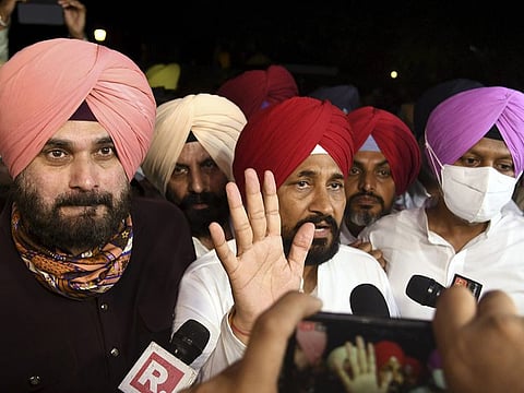 Charanjit Singh Channi outside the Raj Bhawan accompanied by Navjot Singh Sidhu