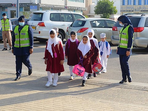 Royal Oman Police were deployed near traffic signals and school premises to ensure orderly traffic flow. They were also seen along with students’ traffic assistants, helping younger kids cross the road.