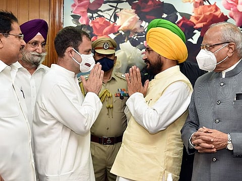 Congress leader Rahul Gandhi greets Channi in presence of Governor Banwarilal Purohit and Punjab Ministers OP Soni and Sukhjinder S Randhawa, at Raj Bhavan in Chandigarh on September 20, 2021. (ANI Photo)