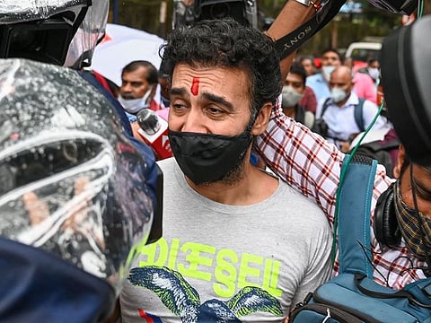 Businessman Raj Kundra in this file photo where he is being escorted by police after his arrest in a pornography racket last year. Kundra has denied he had anything to do with the racket.