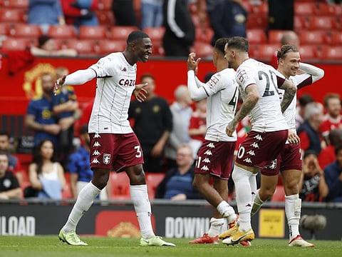 Aston Villa's match winner Kortney Hause celebrates with Danny Ings at full time.