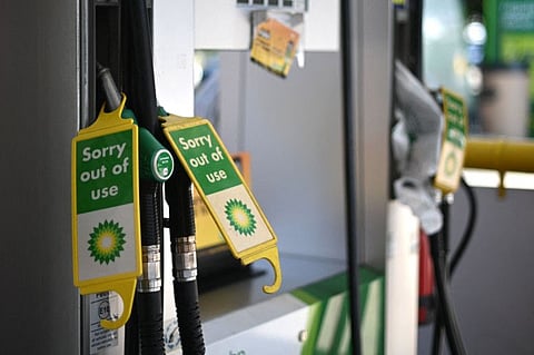 Out of use signs are attached to pumps at a BP petrol station in west London on September 24, 2021. The UK government has urged the public against panic-buying as some petrol stations closed pumps due to a lack of lorry drivers to deliver fuel.