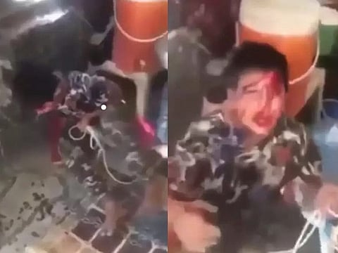 The boy pleading for mercy in the video.