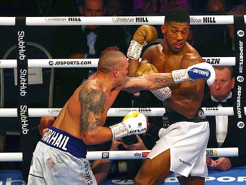Ukrainian boxer Oleksandr Usyk (left) fights British heavyweight champion boxer Anthony Joshua at Tottenham Hotspur Stadium in north London. Usyk defeated Joshua on points.