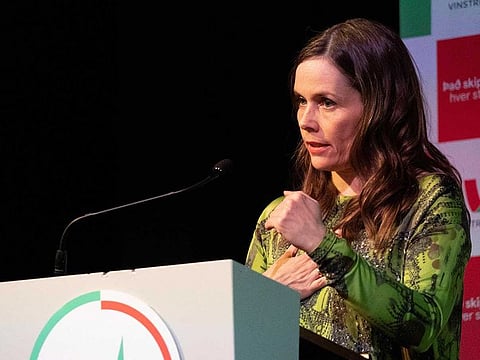 Icelandic Prime Minister Katrin Jakobsdottir talks to supporters of her Left Green Movement at a party event in Reykjavik on September 25, 2021 after the announcement of partial results in the country's general elections.