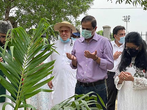 Karachi's Administrator, Murtaza Wahab, accompanied by his wife, plant a tree at Jinnah Urban Forest in Karachi.
