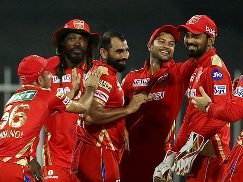 Mohammed Shami of the Punjab Kings celebrates the wicket of David Warner of the Sunrisers Hyderabad during the IPL match at the Sharjah Cricket Stadium on September 25, 2021.