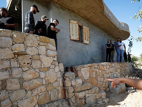 People check the scene where the Palestinians were killed by Israeli forces during a raid, in Beit Anan in the West Bank on September 26, 2021.