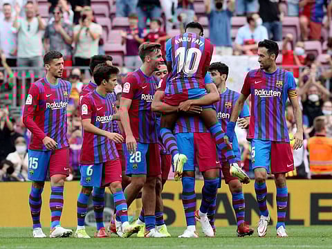 FC Barcelona's Ansu Fati celebrates scoring their third goal with teammates at the Camp Nou.