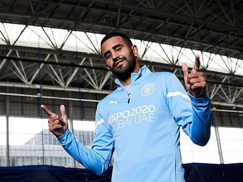 Man City attacker Riyad Mahrez poses in the new training kit with the Expo 2020 Dubai logo.