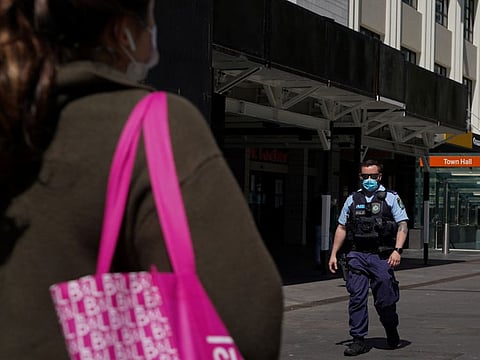 A police officer patrols in the city centre during a lockdown to curb the spread of COVID-19 outbreak in Sydney on September 24.