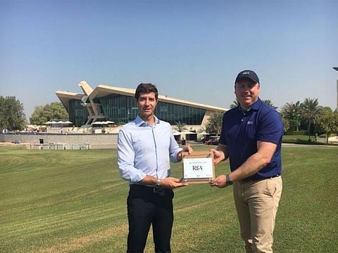 Andrea Faldella, Club Operations Manager, Abu Dhabi Golf Club, receiving the 'R&A Women in Golf Charter' Certificate from Ed Johnson, Assistant Director - R&A Amateur Championships.