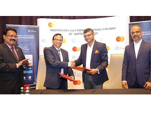 Gaurang Shah, Senior Vice President, Product Management, Digital Payments & Labs, Mastercard Middle East & Africa, and Narayan Pradhan, VP-GCC & India, LuLu Financial Group, sign a partnership between the two companies to enable Mastercard debit card holders in the UAE to send money through the LuLu Money app