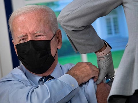 US President Joe Biden receives a third shot of the Pfizer Covid-19 vaccine as a booster on the White House campus September 27, 2021, in Washington, DC.