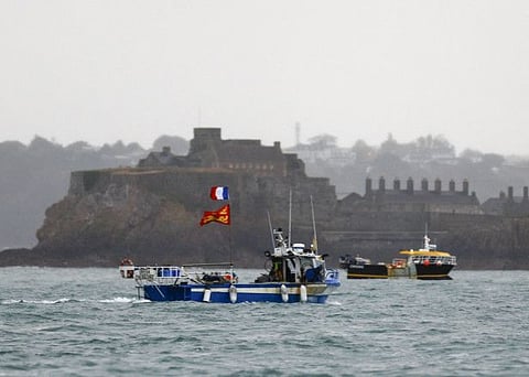 French fishing boats protest in front of the port of Saint Helier off the British island of Jersey in a file photo. France accused Britain of playing politics with post-Brexit fishing rights on Wednesday after London and the Channel Island of Jersey refused dozens of French fishing boats licences to operate in their territorial waters.