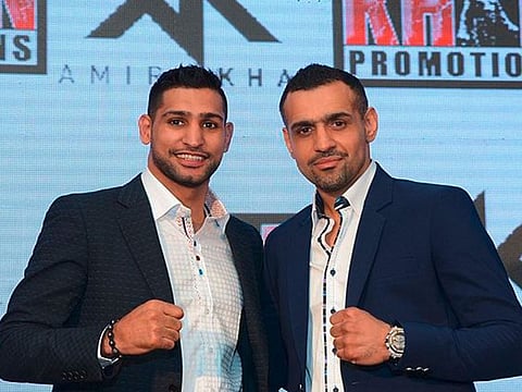 SBL’s CEO and founder Bill Dosanjh with two-time World Boxing Champion & Olympic silver medalist Amir Khan