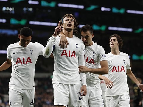 Tottenham Hotspur's Dele Alli celebrates scoring their first goal with Sergio Reguilon. Harry Kane came off the bench to get a hat-trick as Tottenham won 5-1 against Slovenian side NS Mura.