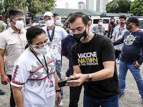 Leni Robredo, Vice-President of the Philippines, left, talks to Isko Moreno, mayor of Manila, at a COVID-19 drive-through vaccination site in Manila, the Philippines, on June 22, 2021.