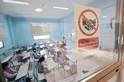 Students attend class at a school in Kuwait City on October 3, 2021, after schools reopened for on-campus learning for the first time after the COVID-19 hit the country..