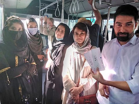 Some of the more than 100 music students and teachers on a bus to catch their flight from Kabul to Doha on October 4, 2021..