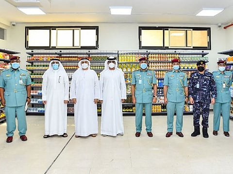 Officials at the new branch of Sharjah Cooperative Society inside Sharjah jail
