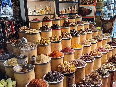 Heaps of spices, various options of oud, clothes, carpets and textiles are available at the Old Bur Dubai souk