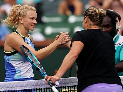 Katerina Siniakova of the Czech Republic shakes hands at the net after her three set victory against Kim Clijsters of Belgium during their first round match on Day 4 of the BNP Paribas Open at the Indian Wells Tennis Garden in Indian Wells, California.