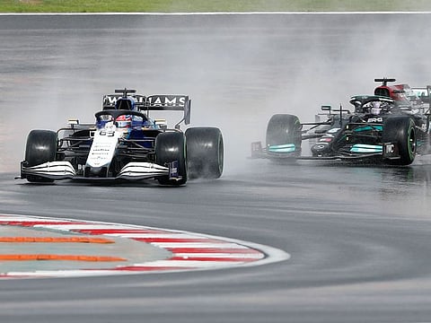 George Russell and Lewis Hamilton at a wet Turkish Grand Prix practice in Istanbul