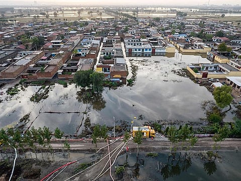 AN aerial photo taken on October 10, 2021 shows a flooded area after heavy rainfalls in Jiexiu, in Jinzhong city, China’s northern Shanxi province.