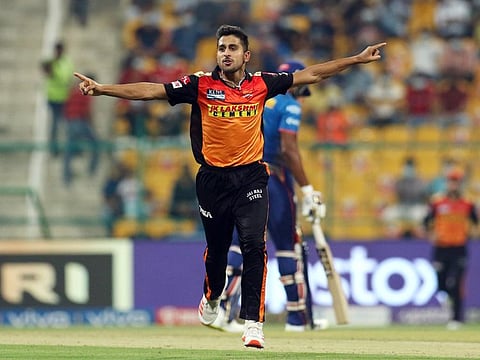 File photo: Umran Malik of Sunrisers Hyderabad celebrates the wicket of Ishan Kishan of Mumbai Indians during the Vivo Indian Premier League match between the Mumbai Indians and the Sunrisers Hyderabad at the Sheikh Zayed Stadium in Abu Dhabi.