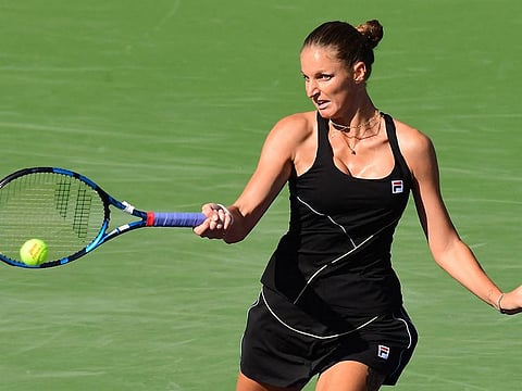 Karolina Pliskova of the Czech Republic hits a forehand return to Beatriz Haddad Maia of Brazil during their third round match at ATP-WTA Indian Wells tennis tournament on October 11, 2021 in Indian Wells, California.