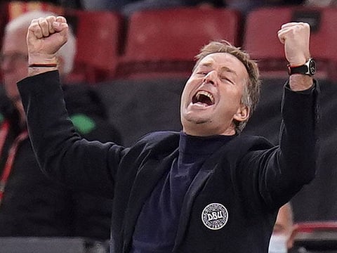 Denmark coach Kasper Hjulmand celebrates after qualifying for the World Cup.