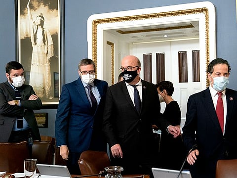 Rep. Jamie Raskin (D-Md.), right, followed by Rep. Jim McGovern (D-Mass.), depart a markup of the Senate Amendment to raising the debt ceiling at the Capitol in Washington on Tuesday, Oct. 12, 2021.