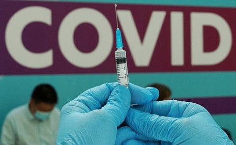 A healthcare worker prepares a dose of Sputnik V vaccine in Gostiny Dvor in Moscow in a file photo.