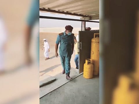 Screen-shot of an official video showing Sharjah Civil Defence teams inspecting gas cylinders
