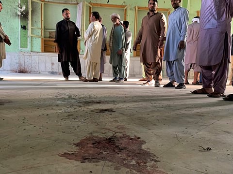 Blood stains is seen inside of a mosque following a suicide attack in the city of Kandahar, southwest Afghanistan, Friday.