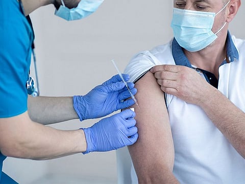 A resident receives the flu vaccine at a SEHA facility in Abu Dhabi emirate