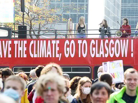 People take part in a Climate March ahead of the COP26 climate summit, in Brussels, Belgium October 10, 2021.