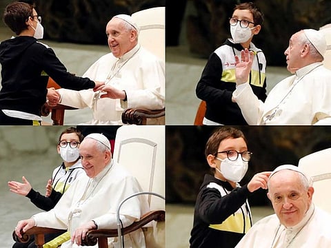 A combination picture shows a boy trying to take Pope Francis' white papal skullcap as he greets him during the weekly general audience at the Vatican, October 20, 2021.