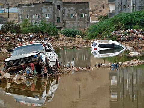 Cars are stuck in muddy water following a flood caused by the Cyclone Shaheen that hit Oman.